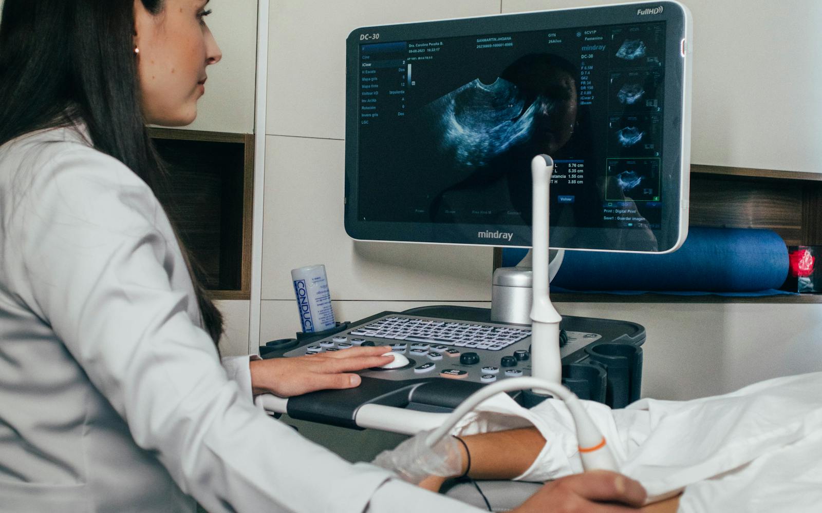 Abdominal ultrasound being performed in a clinic